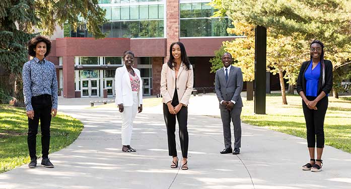 ELITE program student Severino Asumu, Professor Sedami Gnidehou, student Yanela Gonzalez Sanchez, Professor André McDonald and student Imani Murray Internship immerses Black students in STEM, business