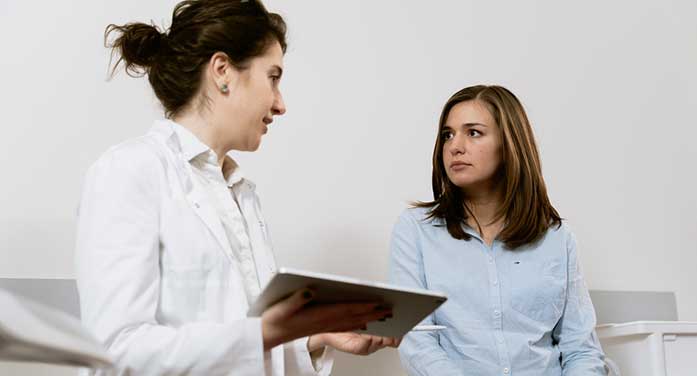young adult woman doctor medical patient